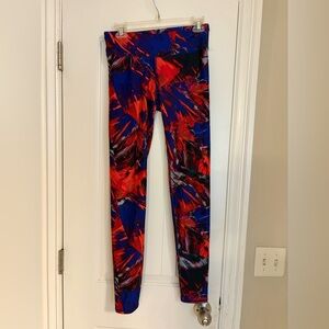 Fabletics womans workout leggings in a size small, vibrant red and blue